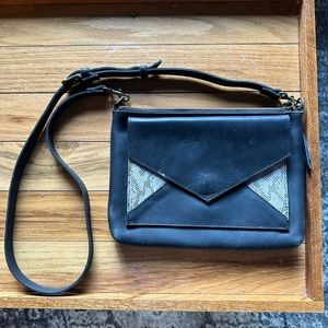 Black clutch from Able. Never used.